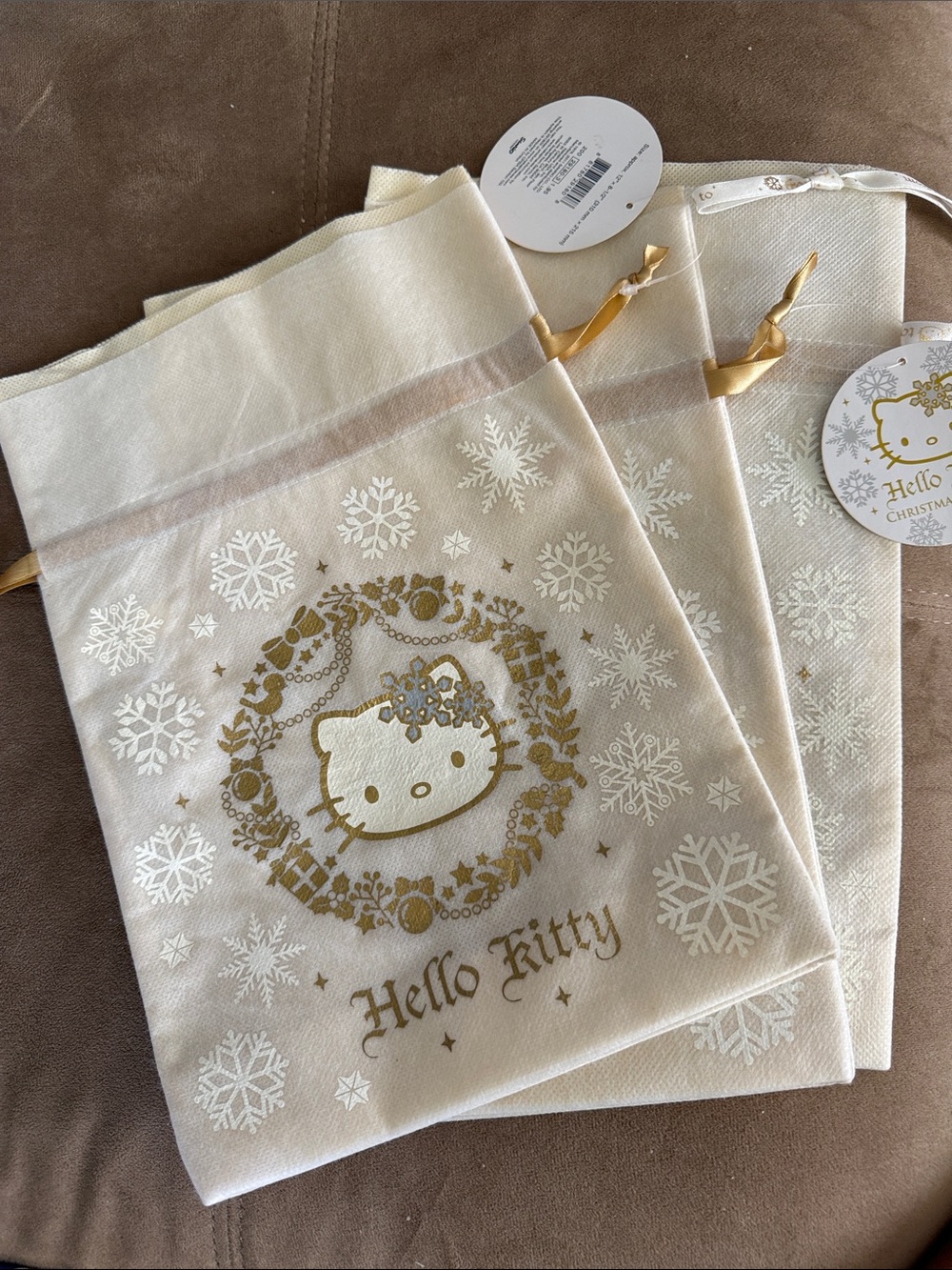 Sanrio Hello Kitty Cream and Gold Holiday Drawstring Bags